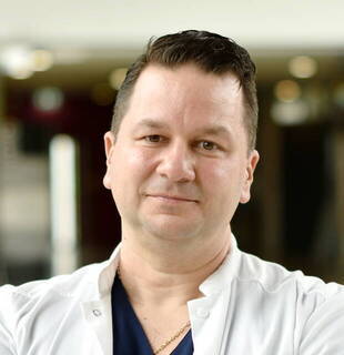 Dr.  Laurentiu Grecu