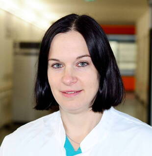 Dr.  Cora Aubele